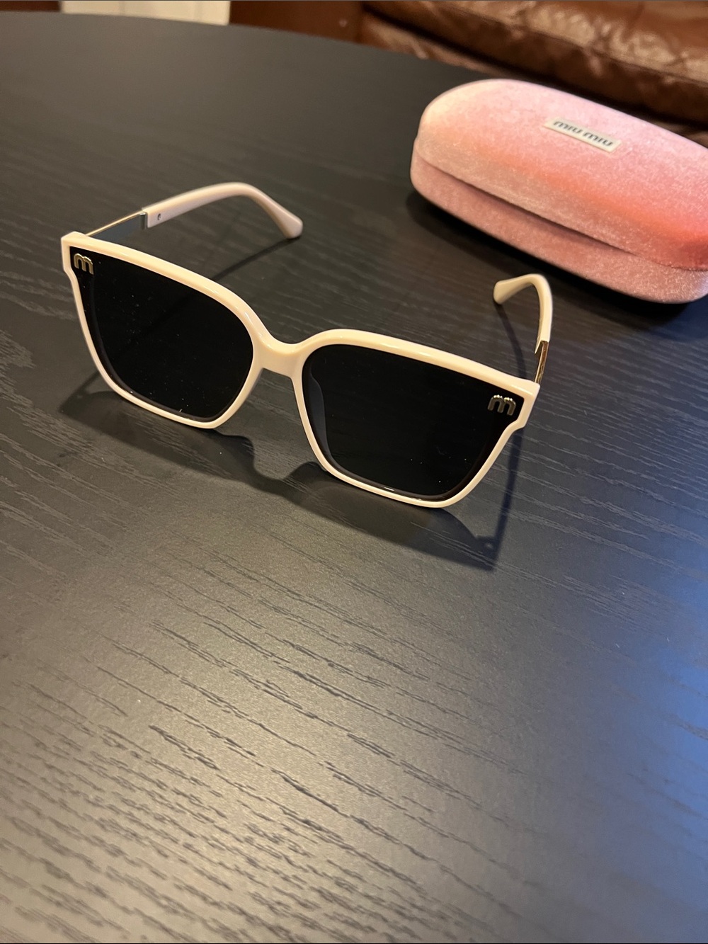 Miu Miu Cream Frame Sunglasses with Black Lenses
